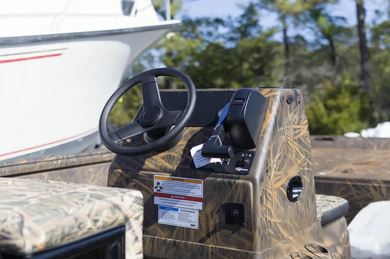 Slide: The Image of 2026 G3 Gator Tough 20 CC boat console with camouflage design and steering wheel. - 8