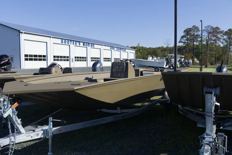 Slide: The Image of 2026 G3 Gator Tough 20 CC boat displayed outside Gootee's Marine showroom. - 3