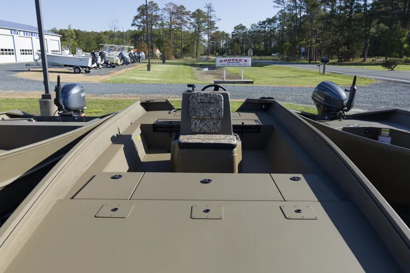 Slide: The Image of 2026 G3 Gator Tough 20 CC boat at dealership, featuring dual outboard motors. - 5