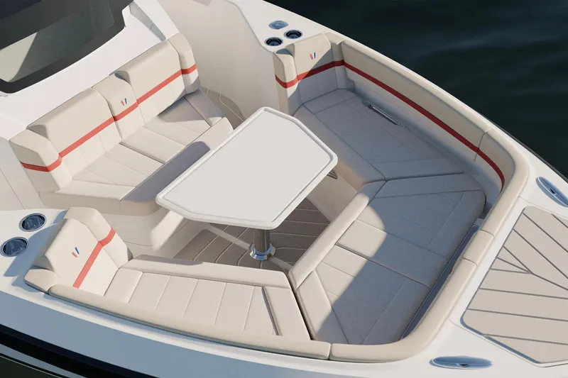 Slide: The Image of Luxurious seating area on 2026 Wellcraft 28 T-Top boat with table and cup holders. - 7