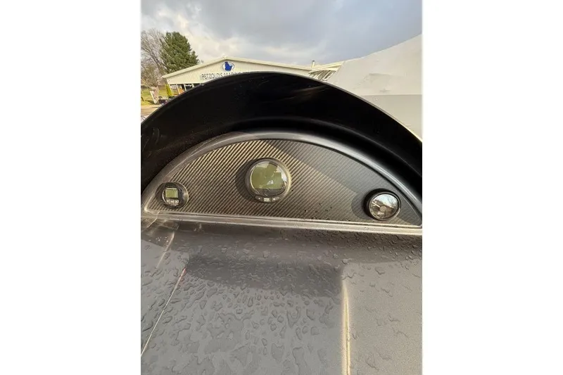 Slide: The Image of Close-up of 2024 Massimo Marine P-22 Limited dashboard with carbon fiber finish. - 10