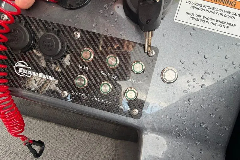 Slide: The Image of Control panel of 2024 Massimo Marine P-22 Limited boat with various function buttons. - 4