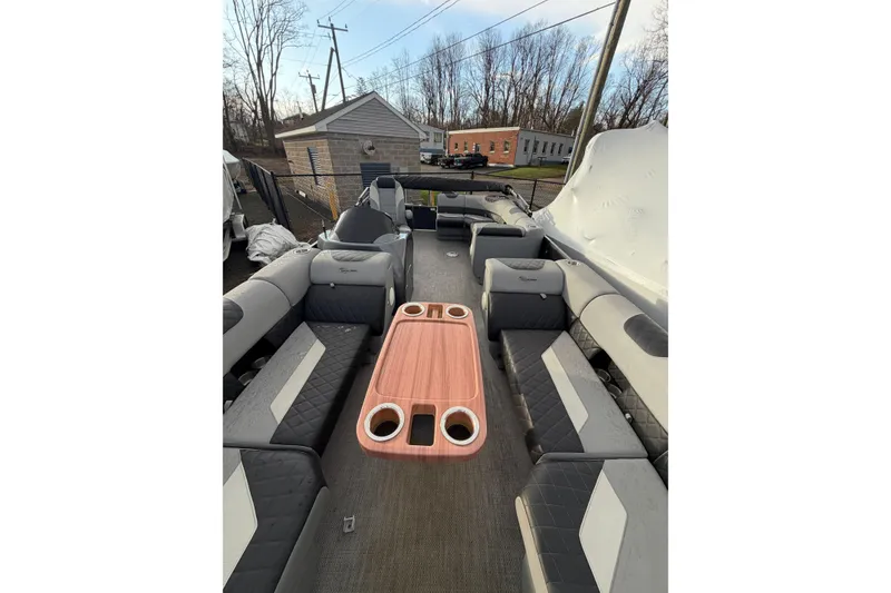 Slide: The Image of 2024 Massimo Marine P-22 Limited pontoon boat interior with seating and table. - 6