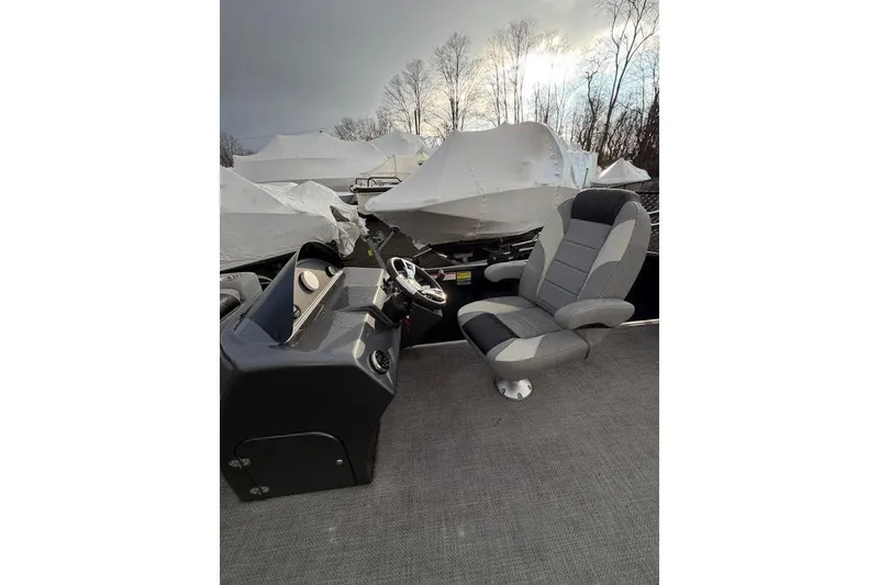 Slide: The Image of 2024 Massimo Marine P-22 Limited boat interior with captain's chair and steering console. - 7