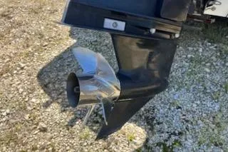 Slide: The Image of 2004 Ranger 210 Reata boat propeller on gravel surface. - 14
