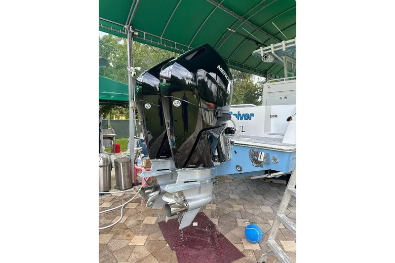 Slide: The Image of 2021 Invincible 33 Open Fisherman boat with dual Mercury outboard engines. - 11