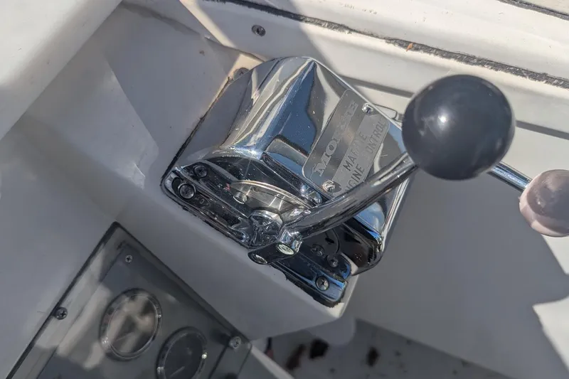 Slide: The Image of Chrome throttle control on a 1993 Shamrock 220 Walkaround boat. - 13