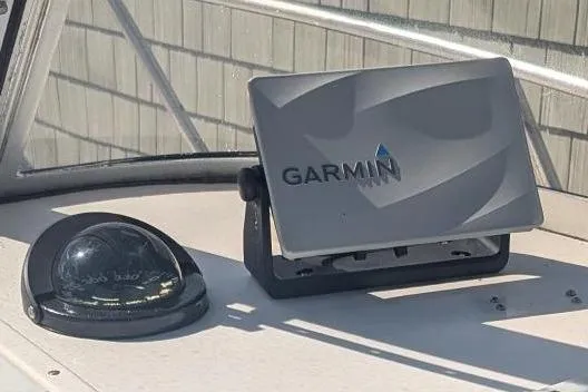 Slide: The Image of Garmin GPS device on 1993 Shamrock 220 Walkaround boat dashboard. - 14
