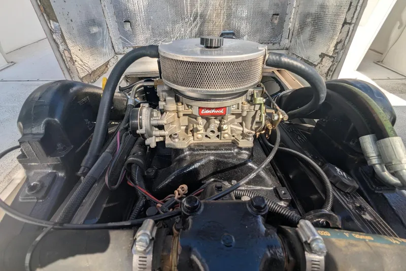 Slide: The Image of Engine of 1993 Shamrock 220 Walkaround boat with Edelbrock carburetor. - 24