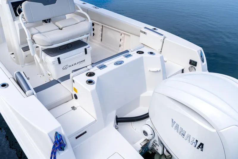 Slide: The Image of 2027 Sailfish 232 CC boat interior with Yamaha engine, featuring seating and storage. - 19