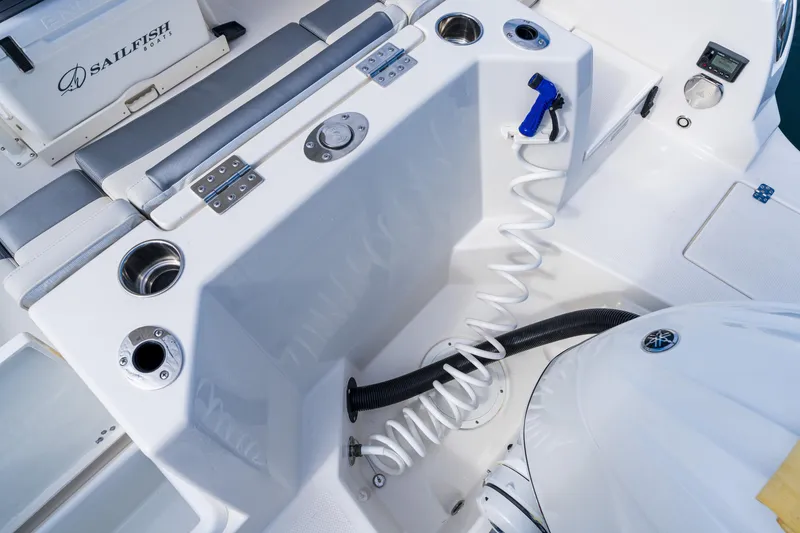 Slide: The Image of Interior view of 2027 Sailfish 232 CC boat featuring seating and utility area. - 21