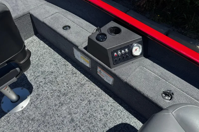 Slide: The Image of Interior of 2026 Tracker Super Guide V-16 T boat with control panel and seating. - 8