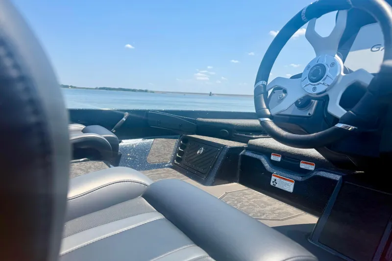 Slide: The Image of Interior view of 2026 Nitro Z21 XL Pro boat with steering wheel and seating. - 11