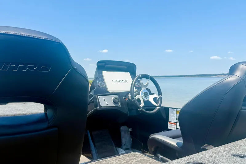 Slide: The Image of 2026 Nitro Z21 XL Pro boat interior with Garmin navigation, overlooking serene waters. - 14
