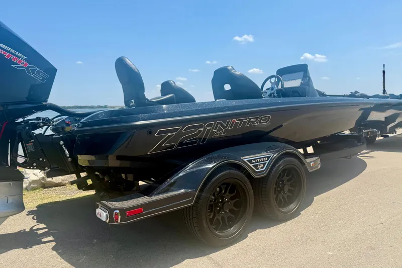 Slide: The Image of 2026 Nitro Z21 XL Pro boat on trailer, featuring sleek design and dual seats. - 2