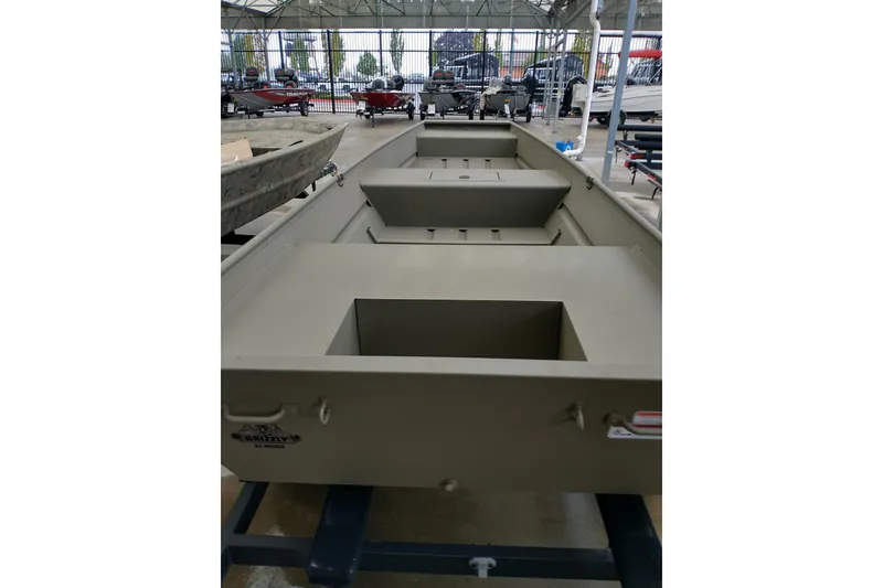 Slide: The Image of 2026 Tracker Grizzly 15 Jon boat displayed in a showroom, showcasing its spacious interior. - 3