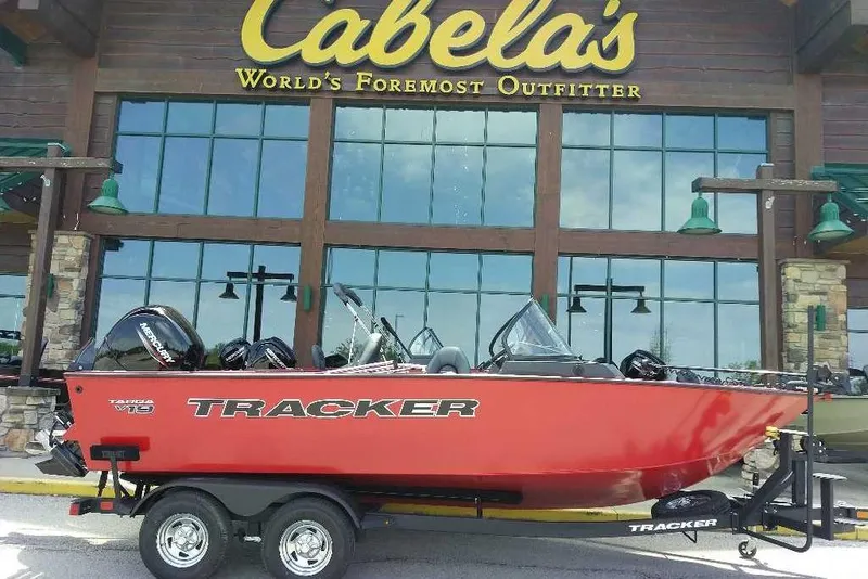 The Image of 2026 Tracker Targa V-19 Combo boat displayed outside Cabela's store. - 0