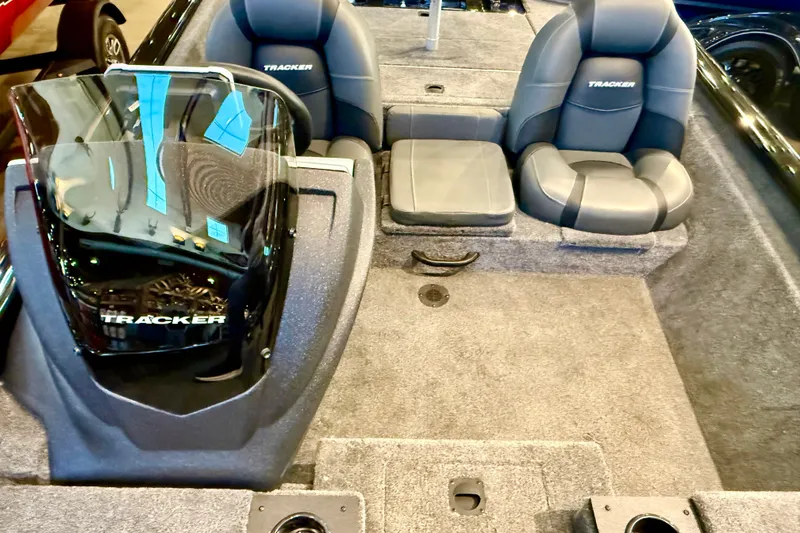 Slide: The Image of 2026 Tracker Pro Team 175 boat interior with seating and console, showcasing modern design. - 13
