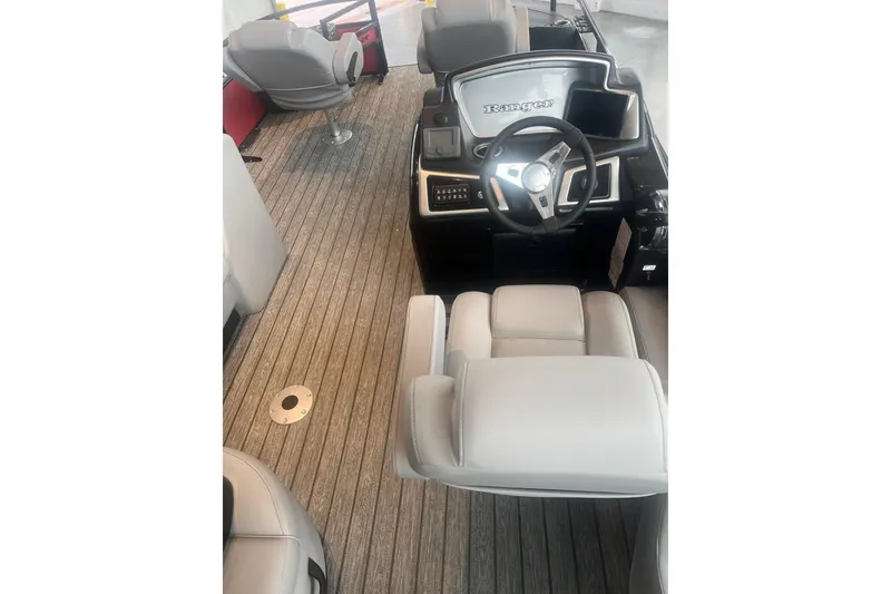 Slide: The Image of 2026 Ranger 220F boat interior with modern steering and comfortable seating. - 3