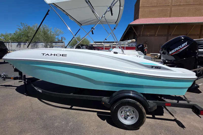 Slide: The Image of 2026 Tahoe T16 boat with canopy and Mercury engine on trailer. - 1