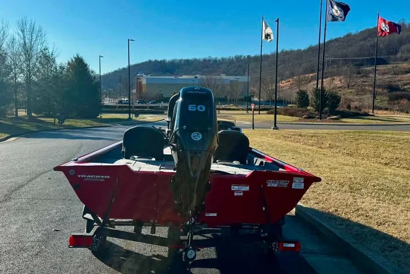 Slide: The Image of 2026 Tracker Pro Team 175 Crappie Edition boat with 60 HP motor in a scenic setting. - 5