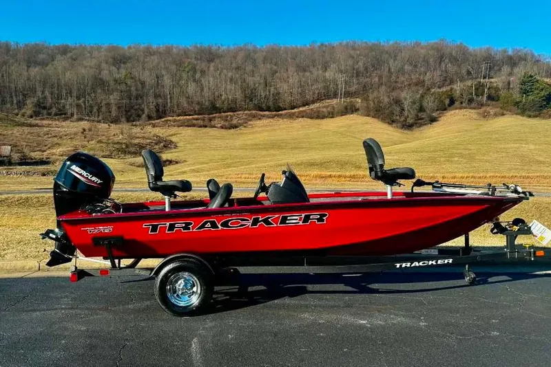 The Image of 2026 Tracker Pro Team 175 Crappie Edition boat in vibrant red on a trailer. - 0