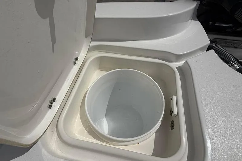 Slide: The Image of Open storage compartment on 2018 Sea Hunt BX 25 FS boat. - 14