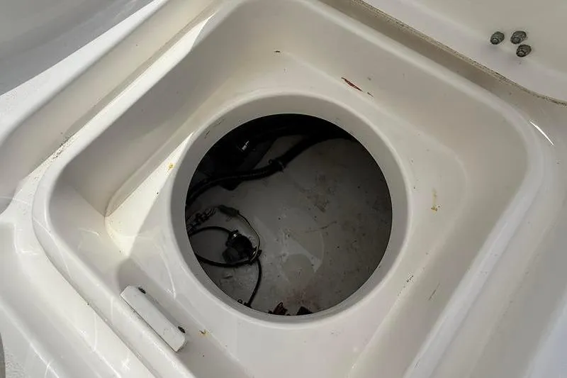 Slide: The Image of Storage compartment of a 2018 Sea Hunt BX 25 FS boat, showing interior details. - 18
