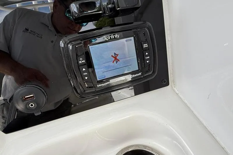 Slide: The Image of Infinity marine stereo on 2018 Sea Hunt BX 25 FS boat dashboard. - 24
