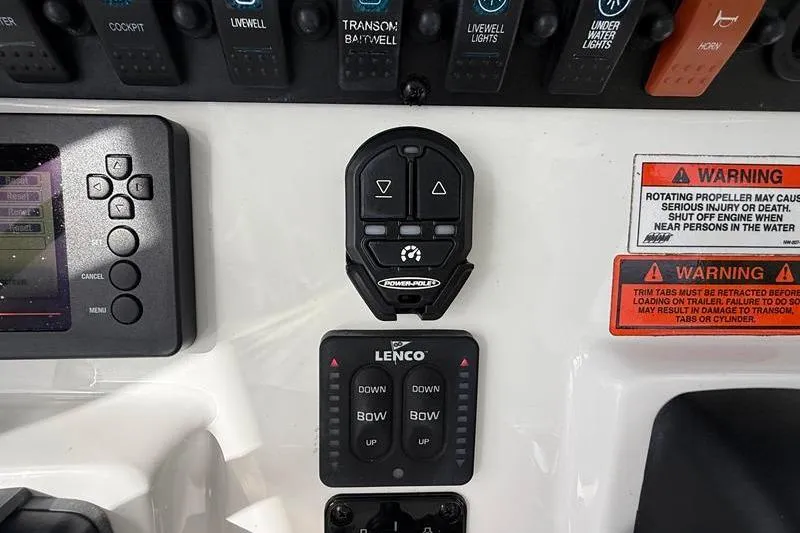 Slide: The Image of Control panel of a 2018 Sea Hunt BX 25 FS boat with warning labels. - 25