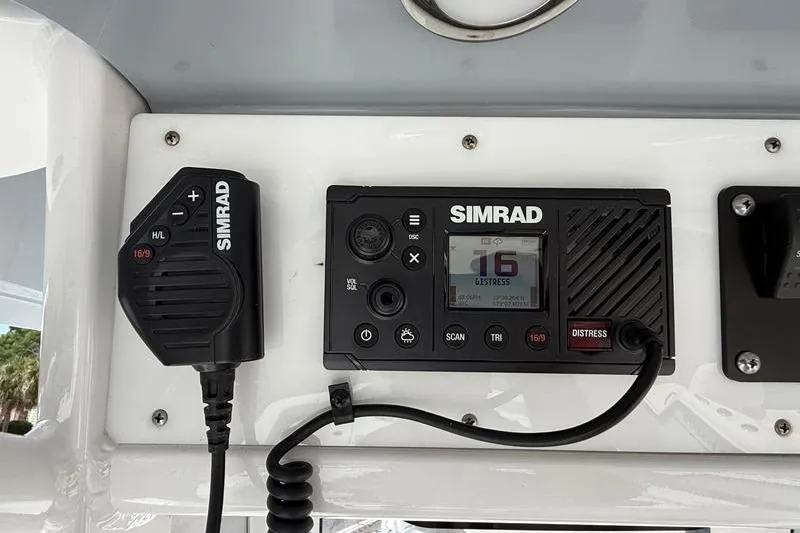 Slide: The Image of Simrad marine radio on 2018 Sea Hunt BX 25 FS boat dashboard. - 26