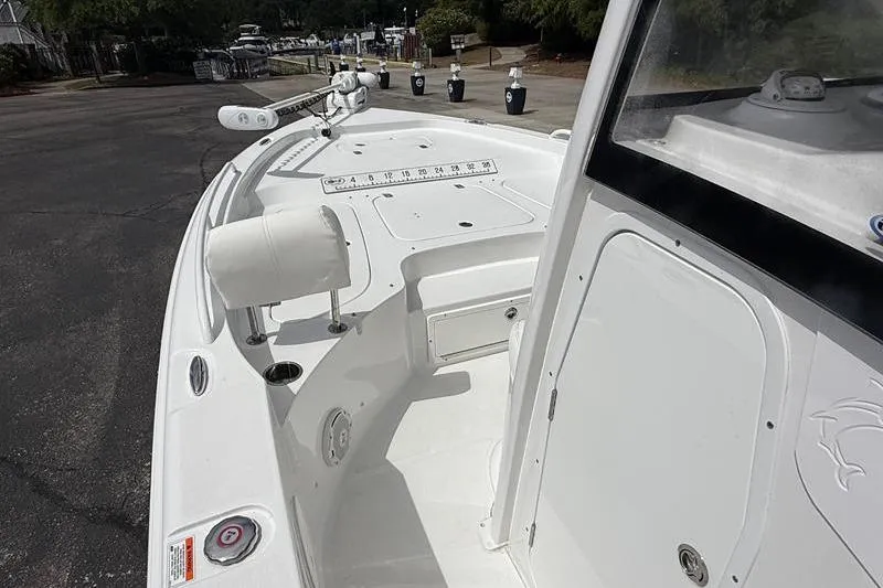Slide: The Image of 2018 Sea Hunt BX 25 FS boat interior with fishing rod holders and seating. - 29