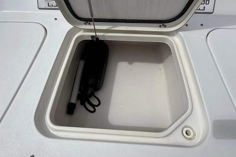 Slide: The Image of Open storage compartment on 2018 Sea Hunt BX 25 FS boat deck. - 32