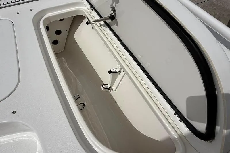 Slide: The Image of Open storage compartment on a 2018 Sea Hunt BX 25 FS boat. - 33