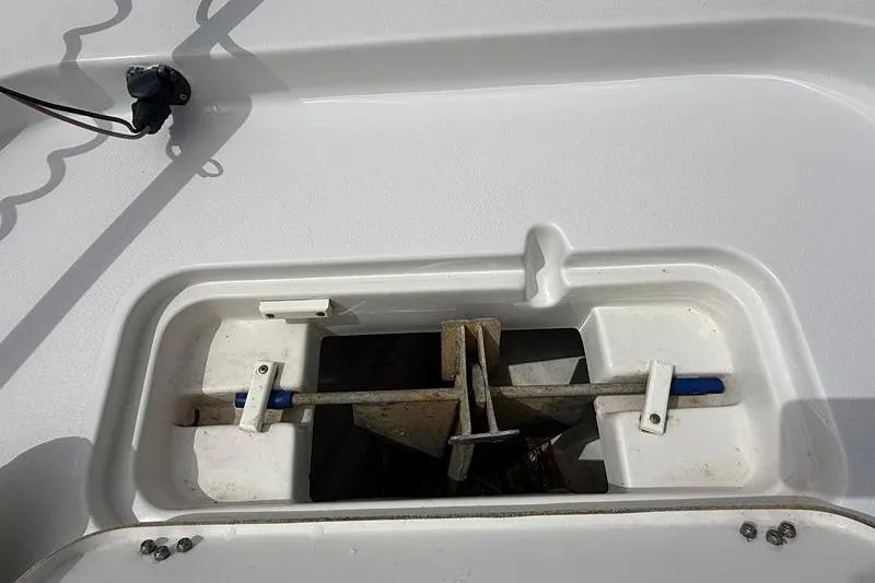 Slide: The Image of Anchor storage compartment on a 2018 Sea Hunt BX 25 FS boat deck. - 34