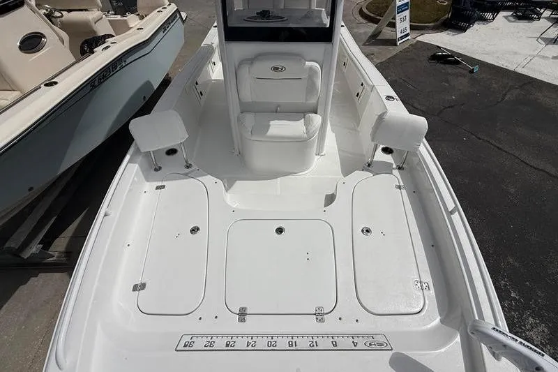 Slide: The Image of 2018 Sea Hunt BX 25 FS boat interior with seating and storage compartments. - 35