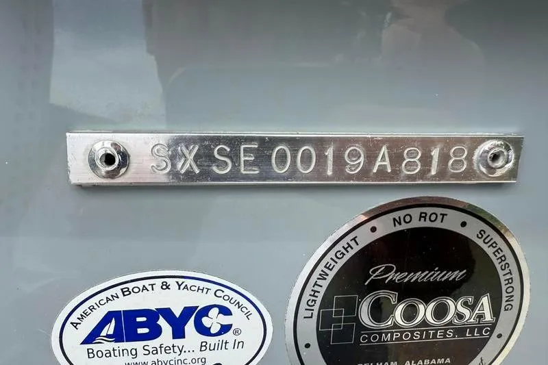 Slide: The Image of 2018 Sea Hunt BX 25 FS boat identification plate with ABYC and Coosa Composites labels. - 41