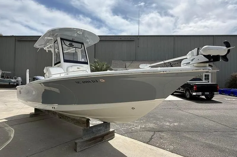 Slide: The Image of 2018 Sea Hunt BX 25 FS boat displayed outdoors on a stand. - 5