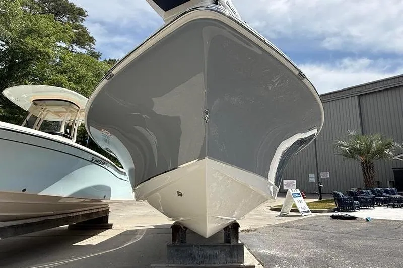 Slide: The Image of 2018 Sea Hunt BX 25 FS boat displayed outdoors on a stand. - 6