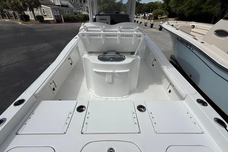 Slide: The Image of 2018 Sea Hunt BX 25 FS boat interior with seating and storage compartments. - 8