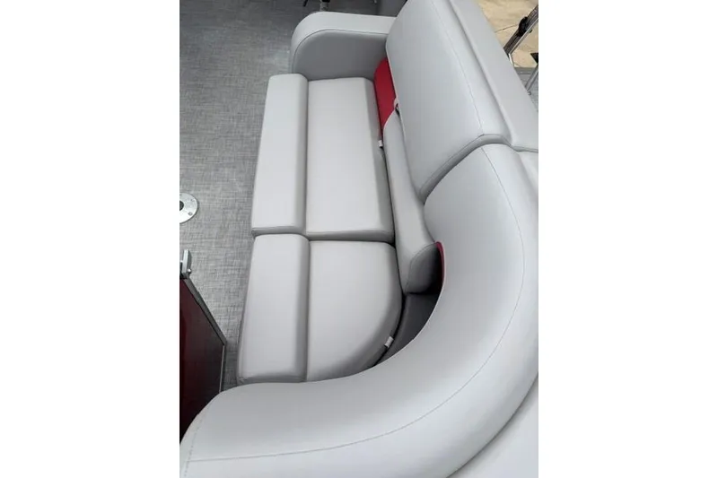 Slide: The Image of 2026 Sun Tracker Party Barge 22 RF DLX, featuring luxurious gray seating. - 9