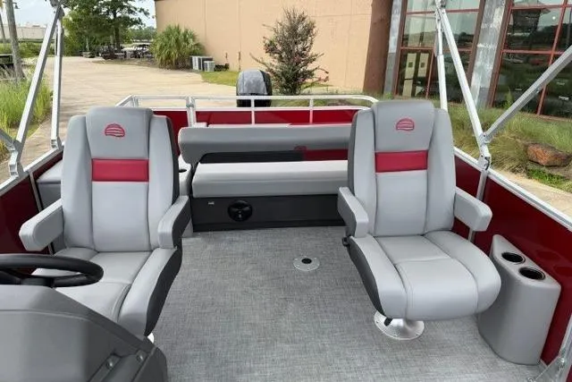 Slide: The Image of 2026 Sun Tracker Party Barge 22 RF DLX interior with gray and red seating. - 5
