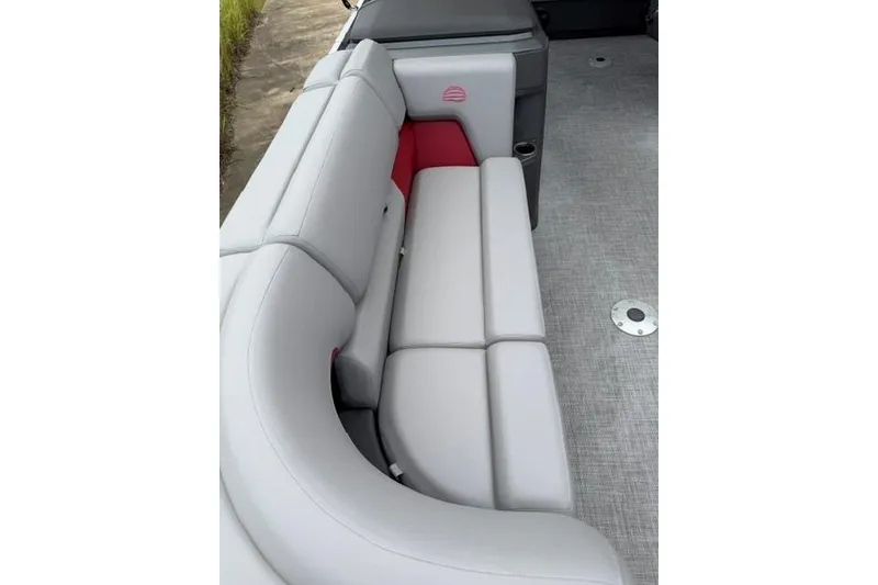 Slide: The Image of 2026 Sun Tracker Party Barge 22 RF DLX interior with plush seating and modern design. - 12