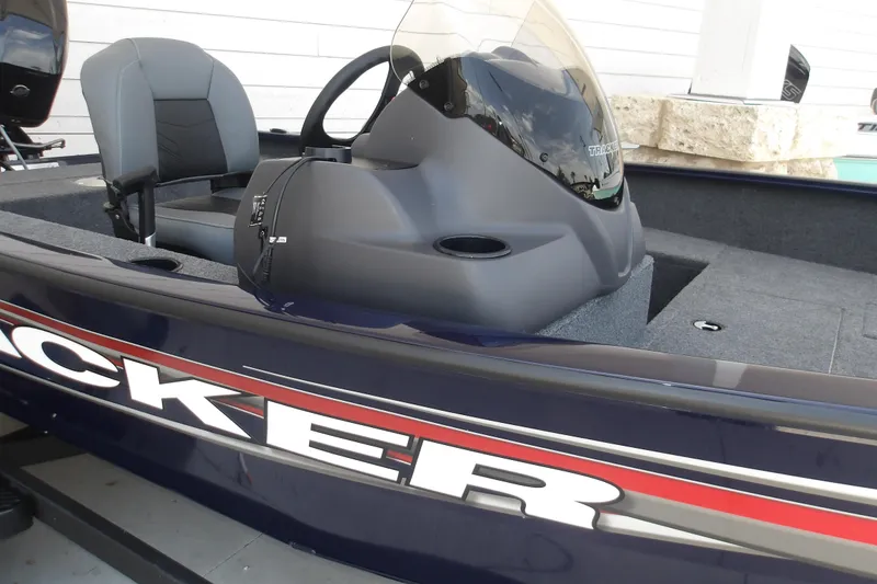 Slide: The Image of 2026 Tracker Super Guide V-16 SC boat interior with steering console and seating. - 8