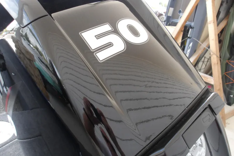 Slide: The Image of Tracker Super Guide V-16 SC 2026 boat engine with '50' decal, sleek black design. - 4