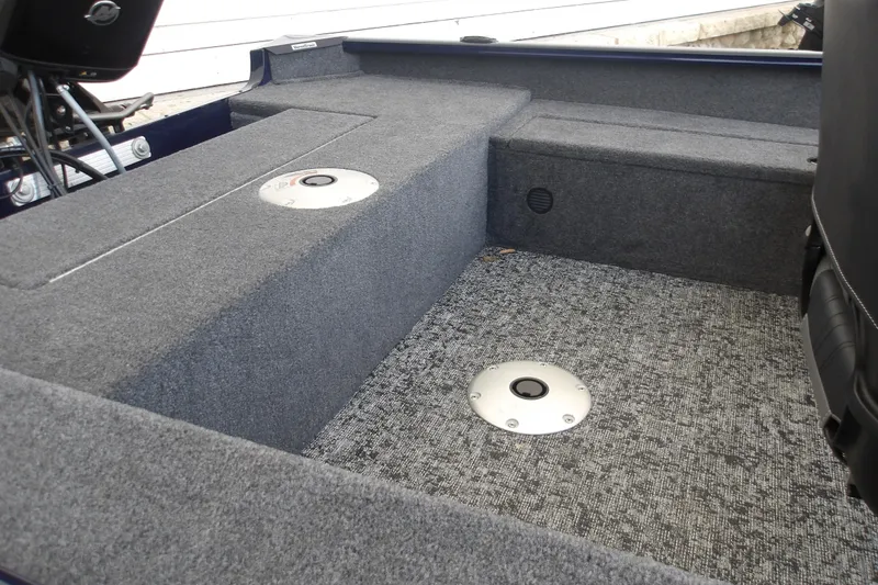 Slide: The Image of Interior of 2026 Tracker Super Guide V-16 SC boat with carpeted flooring. - 10