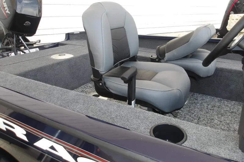 Slide: The Image of 2026 Tracker Super Guide V-16 SC boat interior with gray seating and carpeted flooring. - 9