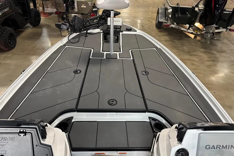 Slide: The Image of 2026 Nitro Z20 XL Pro boat deck with Garmin equipment in showroom setting. - 10