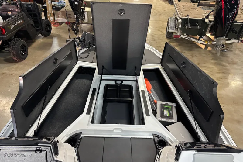 Slide: The Image of 2026 Nitro Z20 XL Pro boat interior with open storage compartments and equipment. - 11