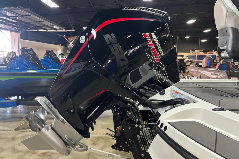 Slide: The Image of 2026 Nitro Z20 XL Pro boat with Mercury Pro XS engine in showroom. - 3